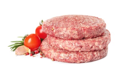 Raw hamburger patties with rosemary, vegetables and pepper on white background