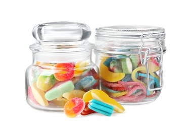 Tasty jelly candies in jars on white background