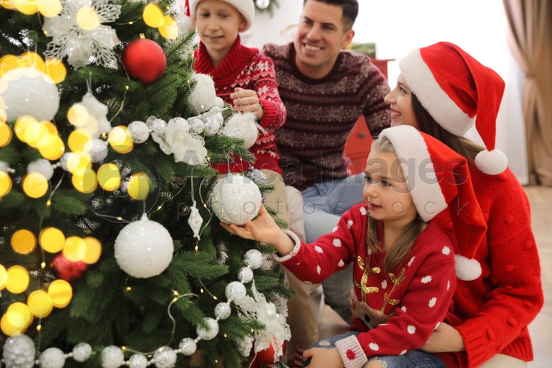 Happy Family With Cute Children Decorating Christmas Tree Together At Home Stock Photo Download On Africa Images 667131 - A Family By Decorating Christmas Tree At Home