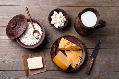 Flat lay composition with dairy products and clay dishware on grey wooden table