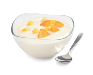 Delicious yogurt with fresh peach in glass bowl and spoon on white background