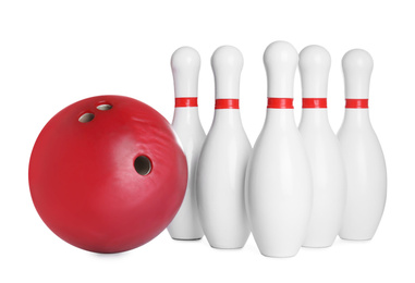 Red bowling ball and pins isolated on white
