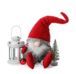 Funny Christmas gnome with tree and lantern on white background