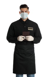 Waiter in medical face mask with notepad on white background