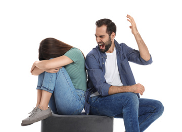 Man shouting at his girlfriend on white background. Relationship problems