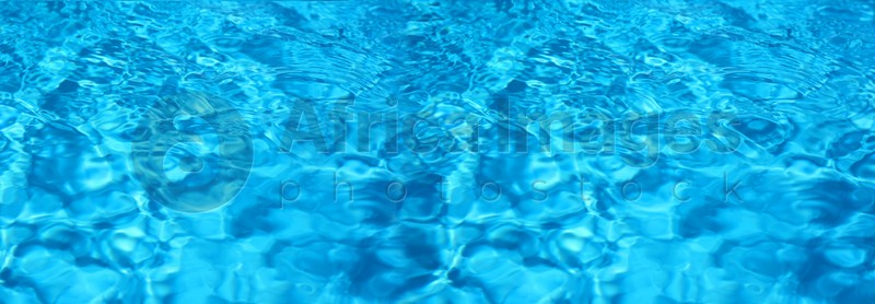 Texture of blue water in swimming pool as background. Banner design