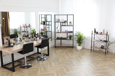 Stylish beauty salon interior with hairdresser's workplace
