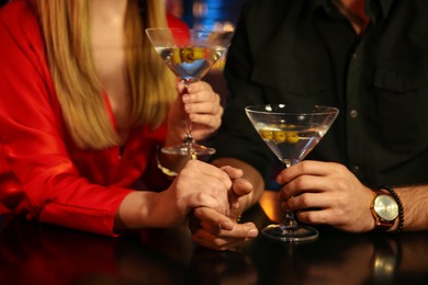 Man and woman flirting with each other in bar, closeup