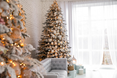 Beautiful interior of living room with decorated Christmas trees