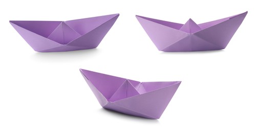 Set with violet paper boats on white background