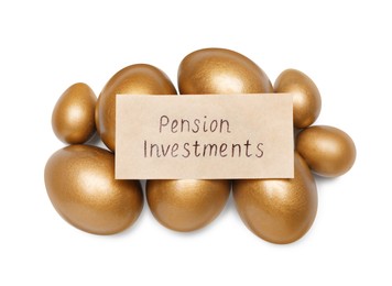 Golden eggs and card with phrase Pension Investments on white background, top view