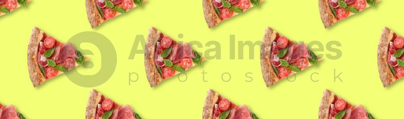 Slices of delicious pizzas on yellow background, flat lay. Seamless pattern design