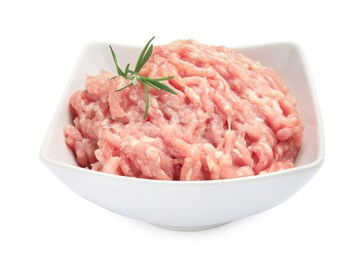 Raw chicken minced meat with rosemary in bowl on white background