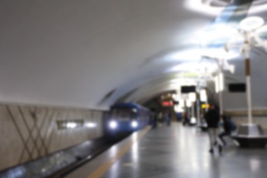 Blurred view of train pulling into subway station. Public transport