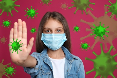 Stop Covid-19 outbreak. Little girl wearing medical mask surrounded by virus on pink background