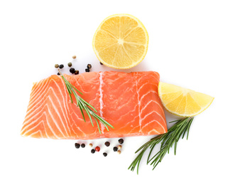 Fresh raw salmon with pepper, lemon and rosemary on white background, top view. Fish delicacy