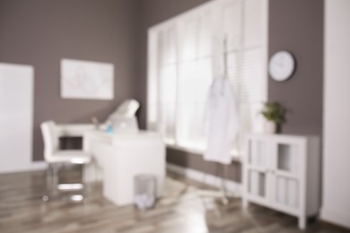 Blurred view of modern medical office with doctor's workplace. Interior design