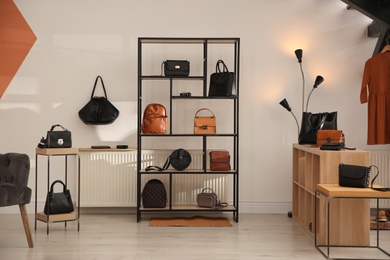 Collection of stylish women's bags and accessories in luxury boutique