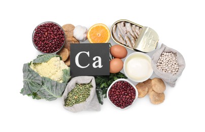 Set of natural food high in calcium on white background, top view