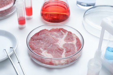 Sample of cultured meat on white lab table