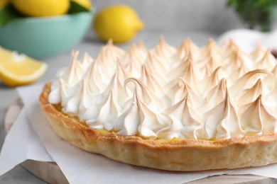 Delicious lemon meringue pie on board, closeup