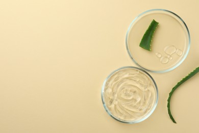 Flat lay composition with Petri dishes and aloe vera on beige background. Space for text