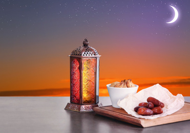 Image of Traditional Ramadan lantern and dry fruits on table. Muslim holiday