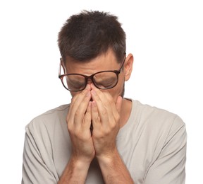 Man suffering from eyestrain on white background