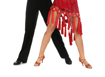 Young couple dancing on white background, closeup of legs