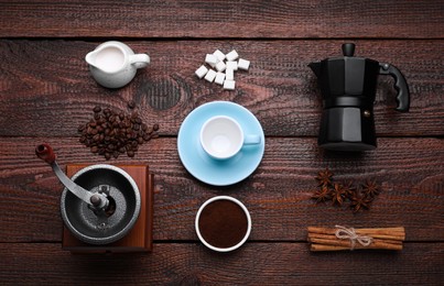Photo of Flat lay composition with vintage manual grinder and geyser coffee maker on wooden background