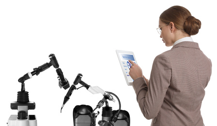 Image of Engineer controlling electronic laboratory robot manipulators with tablet on white background. Machine learning