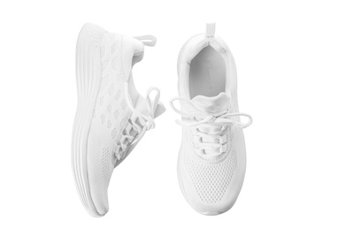 Photo of Stylish sport shoes on white background, top view. Trendy footwear