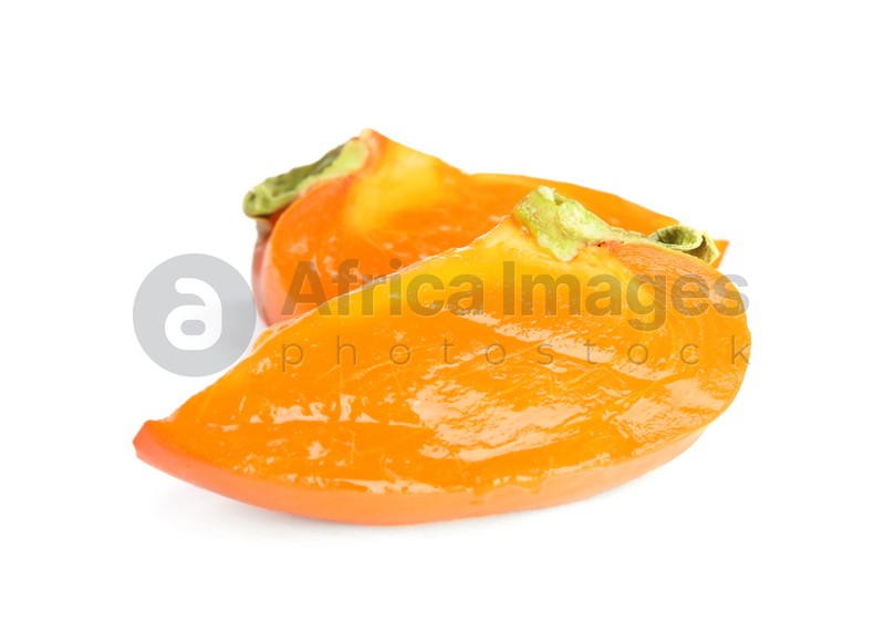 Slices of delicious persimmon isolated on white