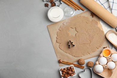 Photo of Homemade Christmas cookies. Flat lay composition with dough and ingredients on light grey table, space for text