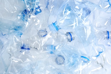 Many used plastic bottles as background, top view. Recycling problem