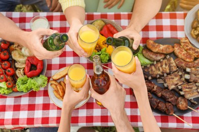 Group of friends with drinks at barbecue party outdoors, top view