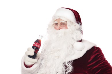 MYKOLAIV, UKRAINE - JANUARY 18, 2021: Santa Claus holding Coca-Cola bottle on white background