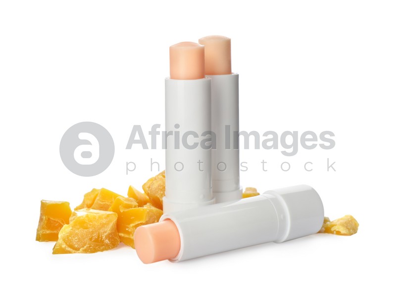 Hygienic lipsticks and natural beeswax on white background