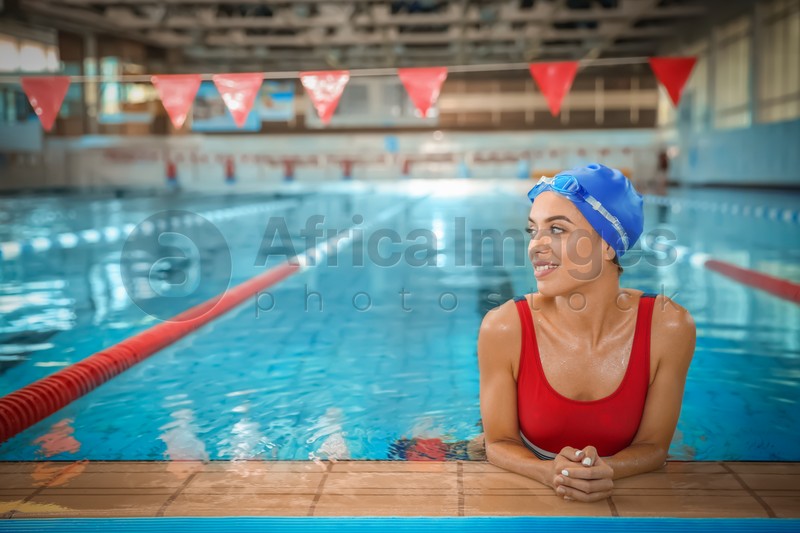 Young athletic woman in swimming pool