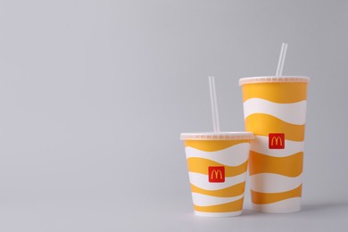 MYKOLAIV, UKRAINE - AUGUST 12, 2021: Cold McDonald's drinks on light background. Space for text
