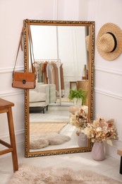 Large mirror and accessories in dressing room. Interior design
