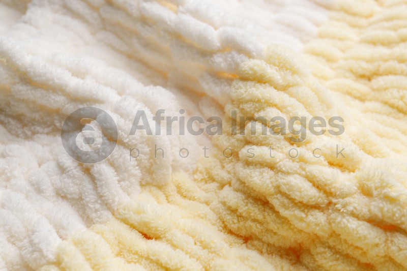 Texture of soft knitted fabric as background, closeup