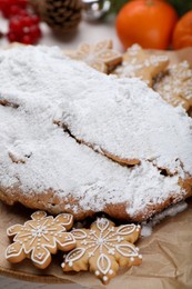 Traditional Christmas Stollen with icing sugar, closeup