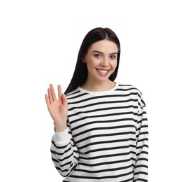 Attractive young woman showing hello gesture on white background