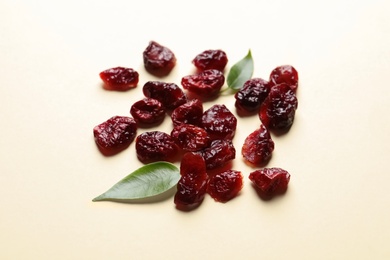 Cranberries on color background. Dried fruit as healthy snack