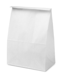 Closed paper grocery bag isolated on white