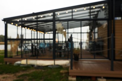 Restaurant with outdoor terrace for rent, blurred view. Real estate