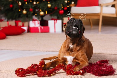Photo of Cute dog wearing festive headband in room decorated for Christmas