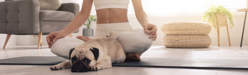 Image of Woman with dog practicing yoga at home. Horizontal banner design 