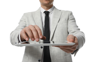 Businessman using tablet computer on white background, closeup